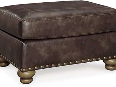 Signature Design by Ashley Nicorvo Traditional Faux Leather Ottoman with Gold Nailhead Trim, Brown